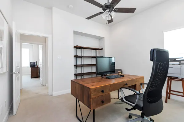 a view of a workspace with furniture