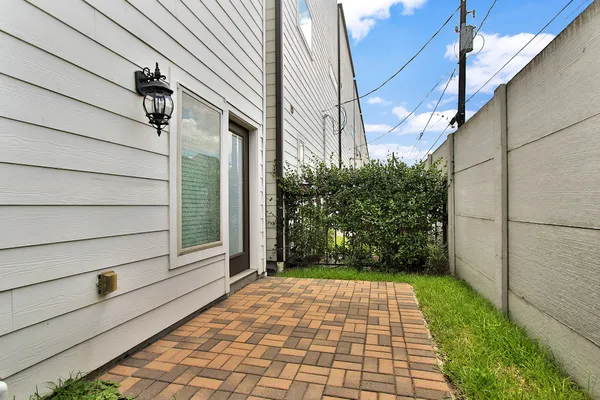 a view of a pathway both side of house
