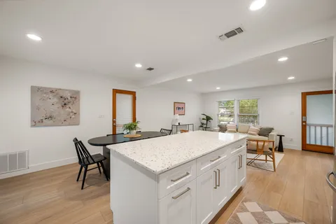 a kitchen with a stove microwave and cabinets