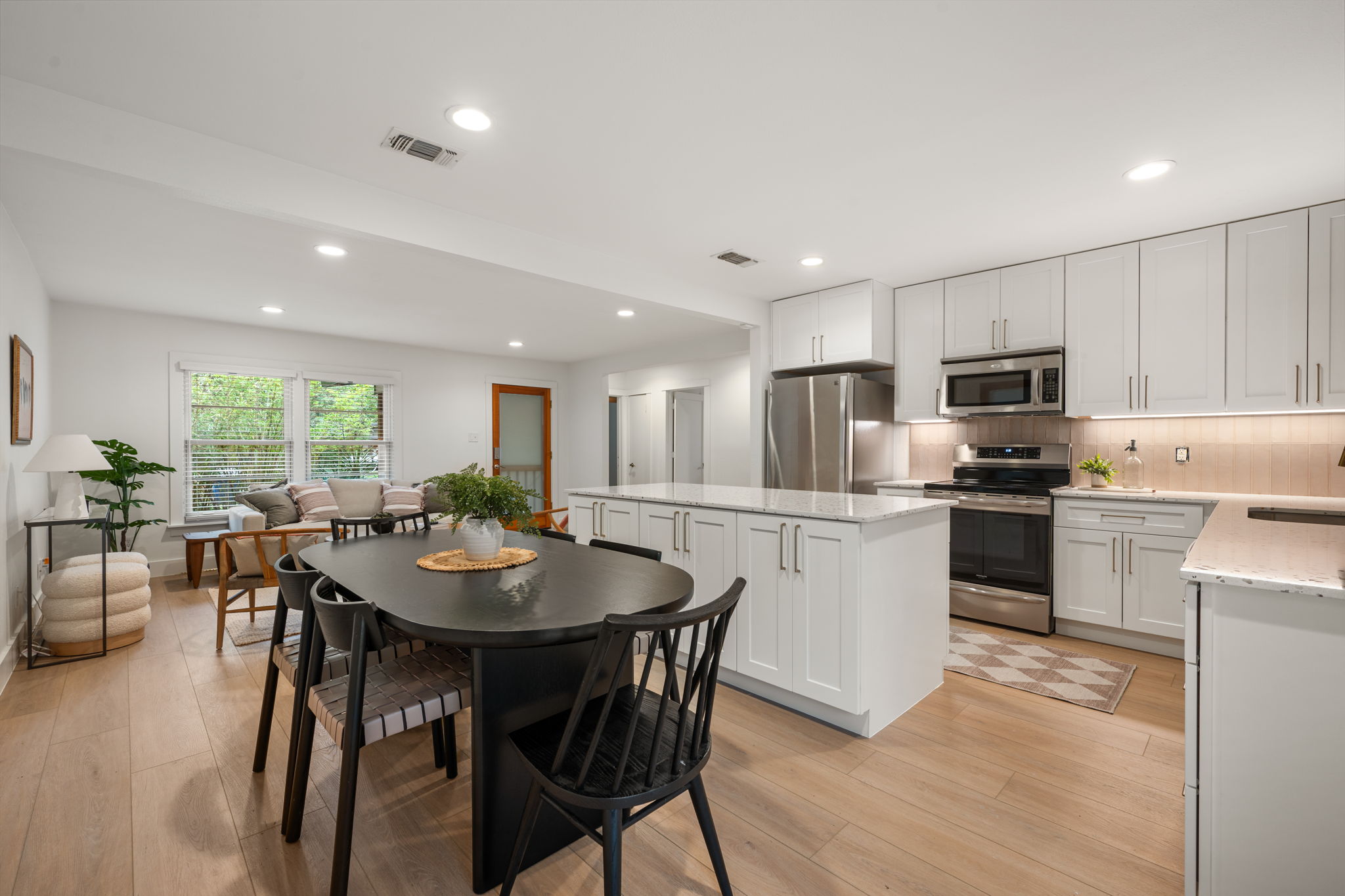5506 Duval Street Austin, TX 78751 - Photo 17 of 38 a kitchen with a table and chairs in it
