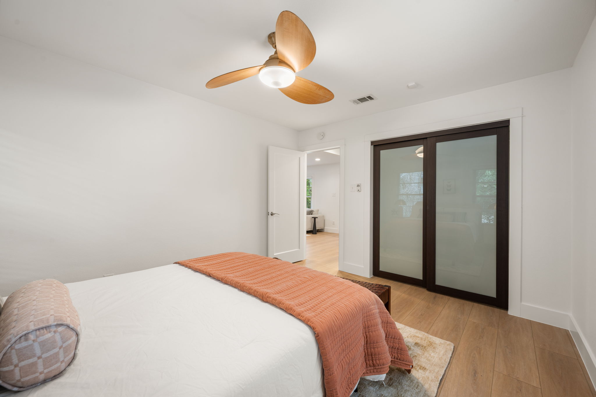 5506 Duval Street Austin, TX 78751 - Photo 19 of 38 a bedroom with a bed and a chandelier