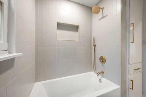 a bathroom with a sink a toilet and bathtub