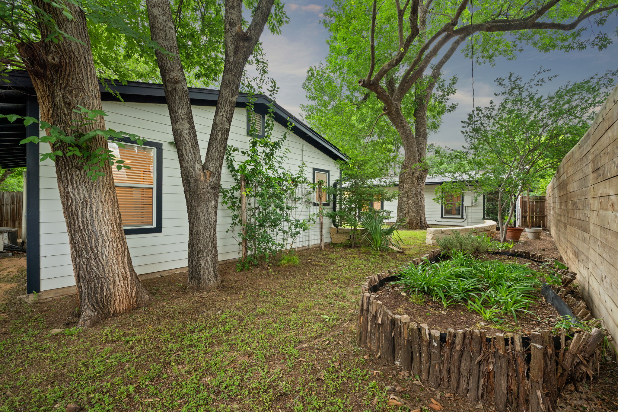 5506 Duval Street Austin, TX 78751 - Photo 27 of 38 a front view of a house with a yard