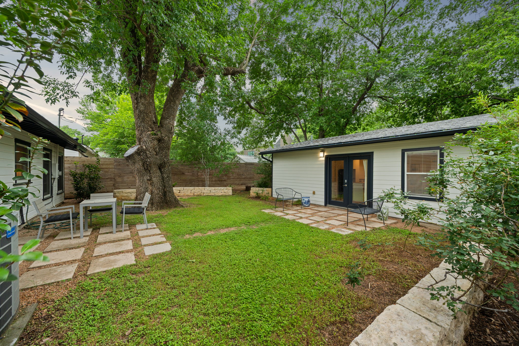 5506 Duval Street Austin, TX 78751 - Photo 3 of 38 a view of a backyard with a sitting area