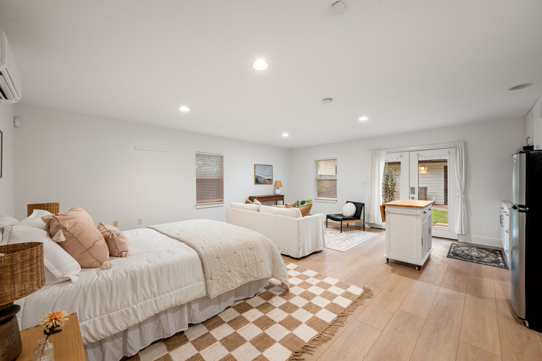 5506 Duval Street Austin, TX 78751 - Photo 31 of 38 a bedroom with furniture and wooden floor