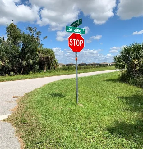 a view of a street with a yard