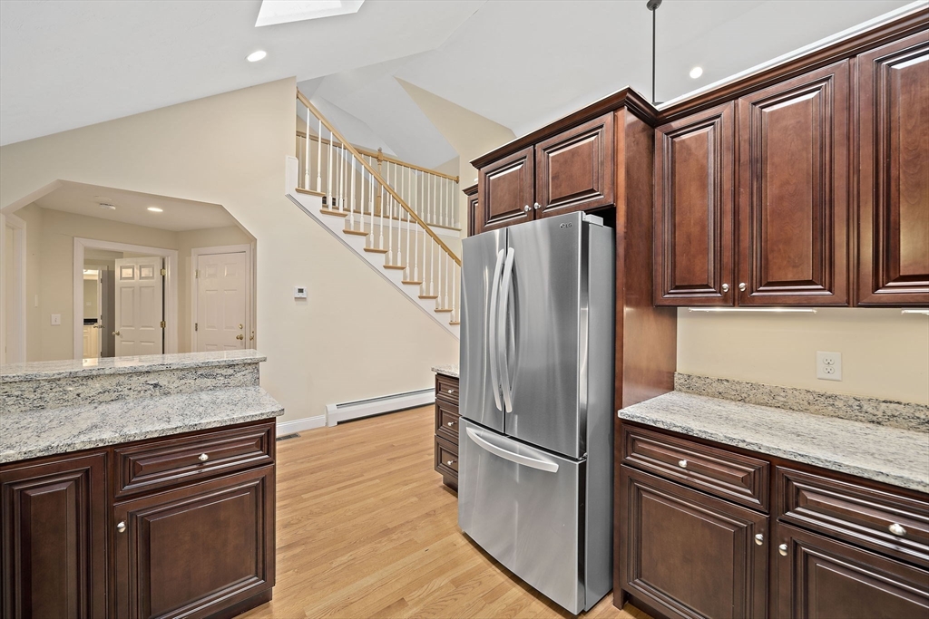 14 Sugar Maple Circle, Unit 14 Hanover, MA 02339 - Photo 5 of 38 a kitchen with granite countertop a refrigerator and a sink