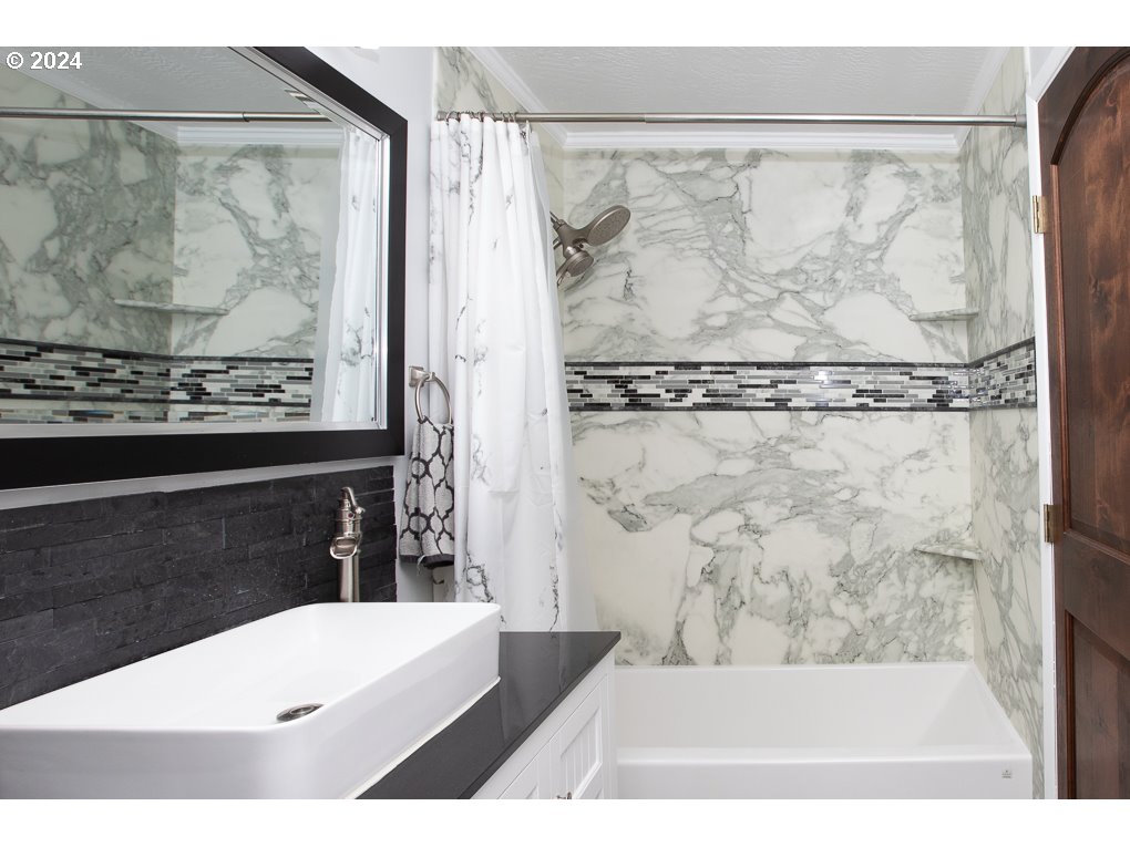 594 South 72nd Street Springfield, OR 97478 - Photo 11 of 14 a bathroom with a bathtub and shower