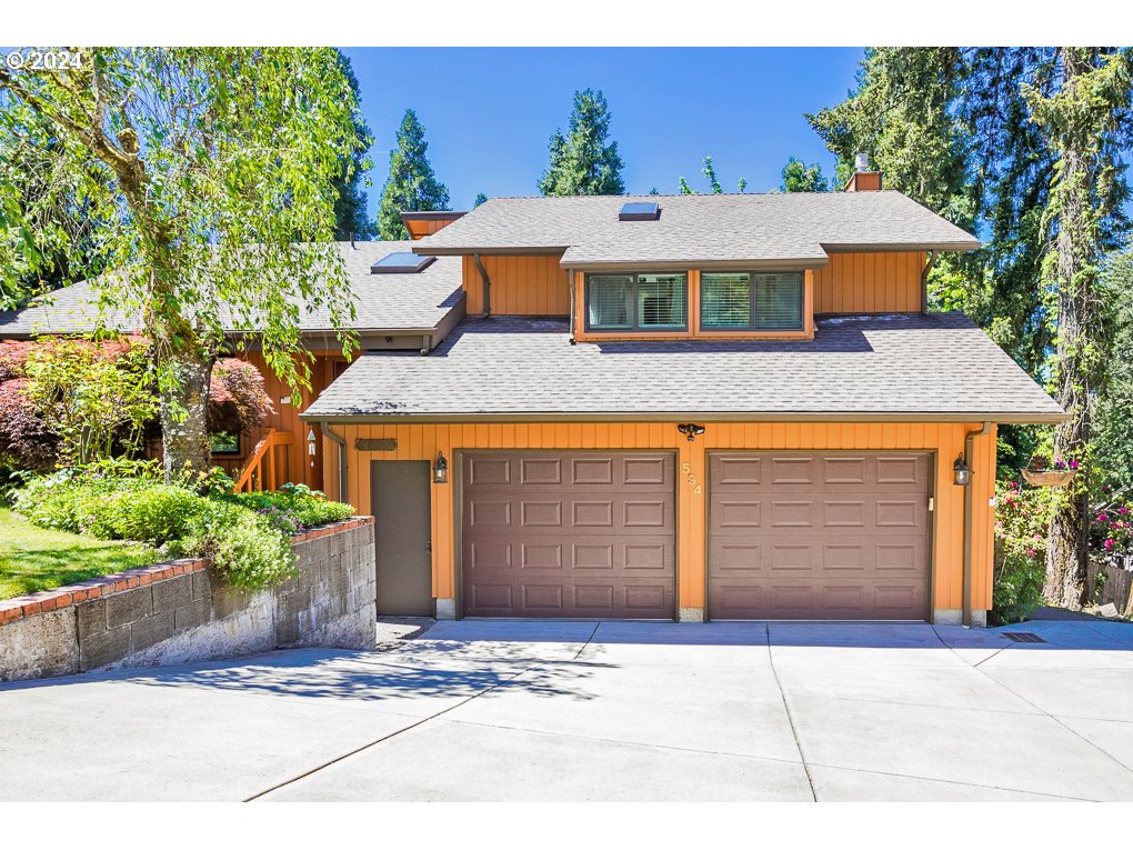 594 South 72nd Street Springfield, OR 97478 - Photo 3 of 14 a front view of a house with a yard and garage