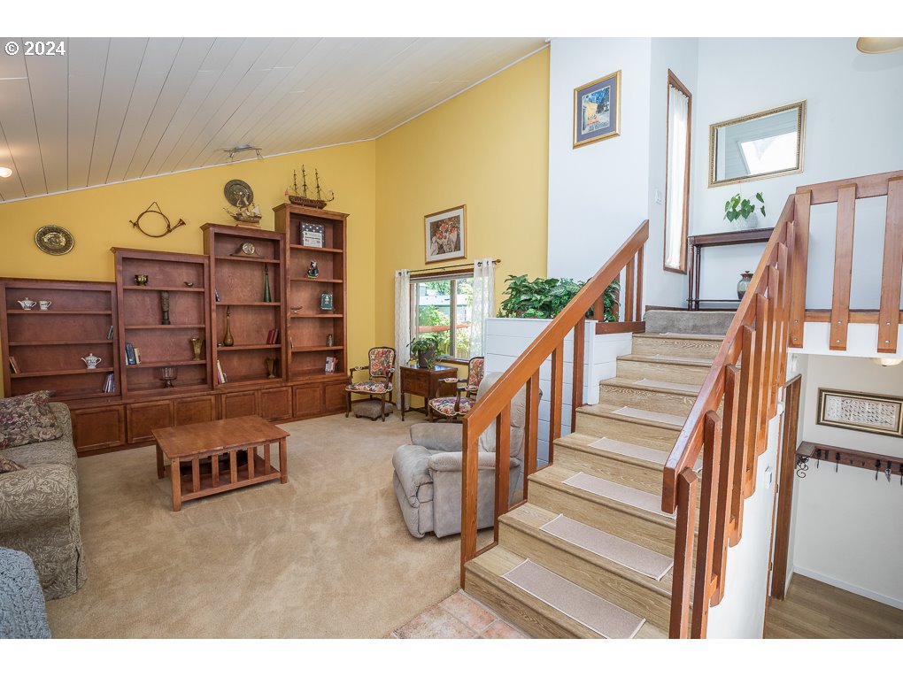 594 South 72nd Street Springfield, OR 97478 - Photo 5 of 14 a view of a livingroom with furniture and stairs