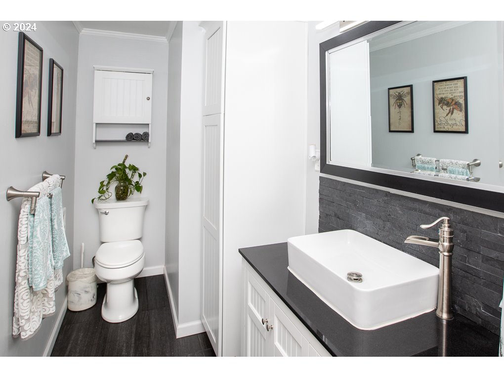 594 South 72nd Street Springfield, OR 97478 - Photo 10 of 14 a bathroom with a sink toilet and mirror
