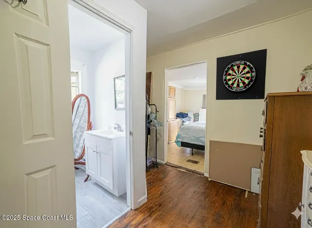 a room with a refrigerator and a stove