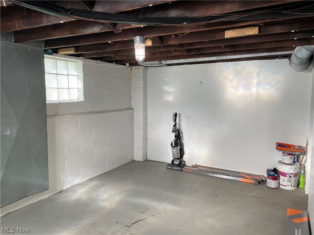 1730 Burgess Road Cleveland, OH 44112 - Photo 21 of 35 First basement room, featuring glass block windows