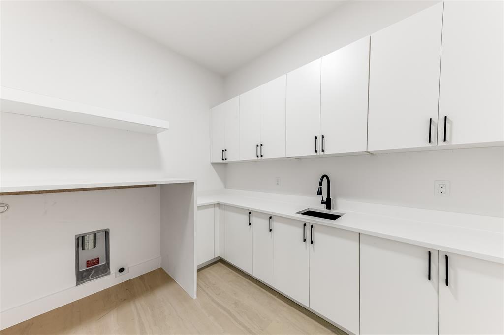 229 Sunset Pt Trail Heath, TX 75032 - Photo 14 of 40 a kitchen with granite countertop a sink a stove and cabinets