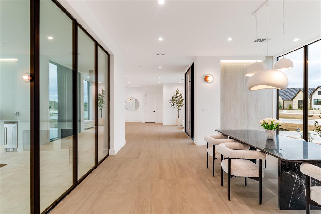229 Sunset Pt Trail Heath, TX 75032 - Photo 16 of 40 a view of a hallway with furniture and a mirror
