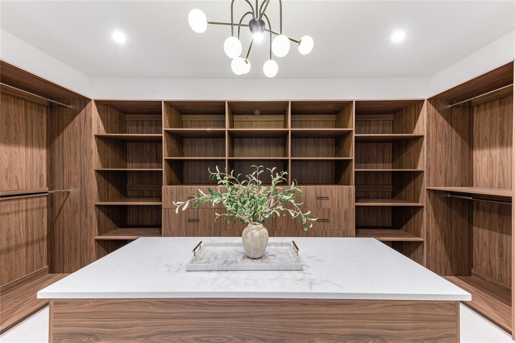 229 Sunset Pt Trail Heath, TX 75032 - Photo 23 of 40 a view of a living room with a potted plant and a wooden floor
