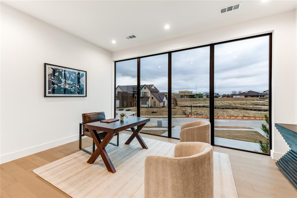 229 Sunset Pt Trail Heath, TX 75032 - Photo 27 of 40 a living room with furniture and a large window