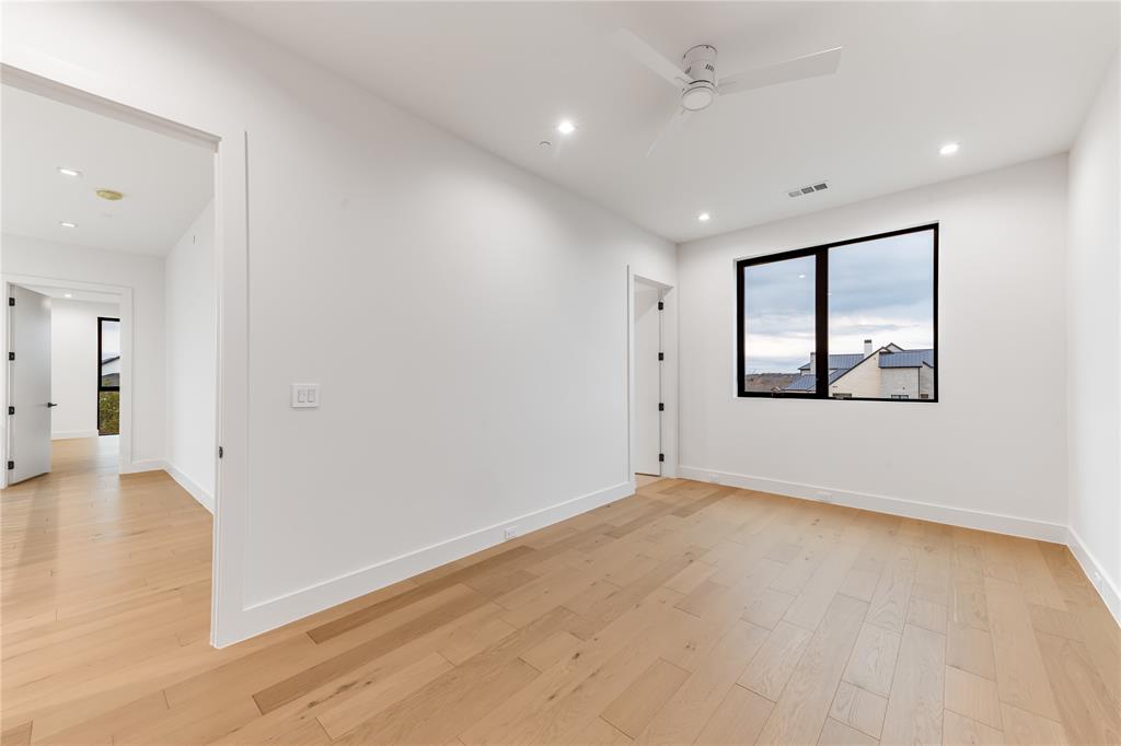 229 Sunset Pt Trail Heath, TX 75032 - Photo 28 of 40 an empty room with wooden floor and windows