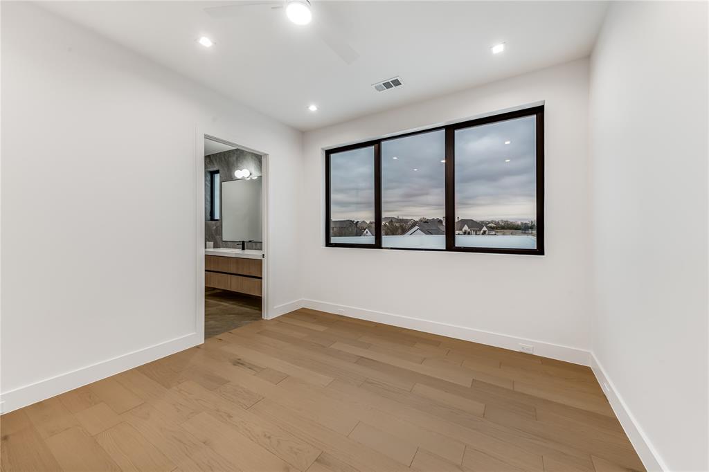229 Sunset Pt Trail Heath, TX 75032 - Photo 32 of 40 an empty room with windows and cabinet