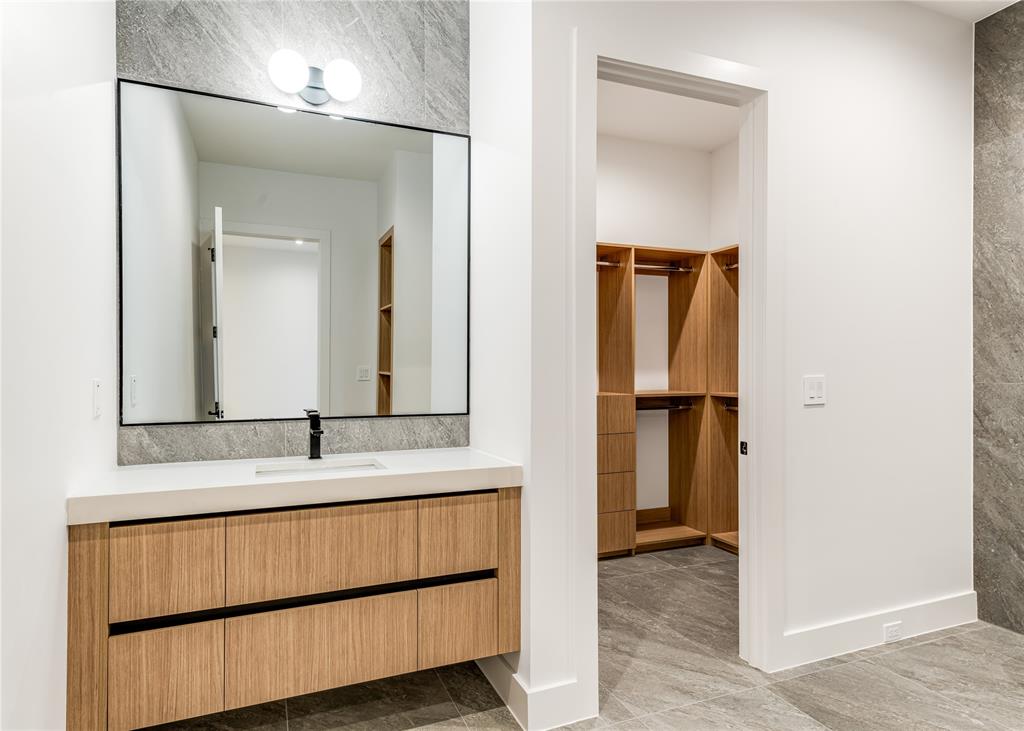 229 Sunset Pt Trail Heath, TX 75032 - Photo 34 of 40 a bathroom with a sink and a mirror