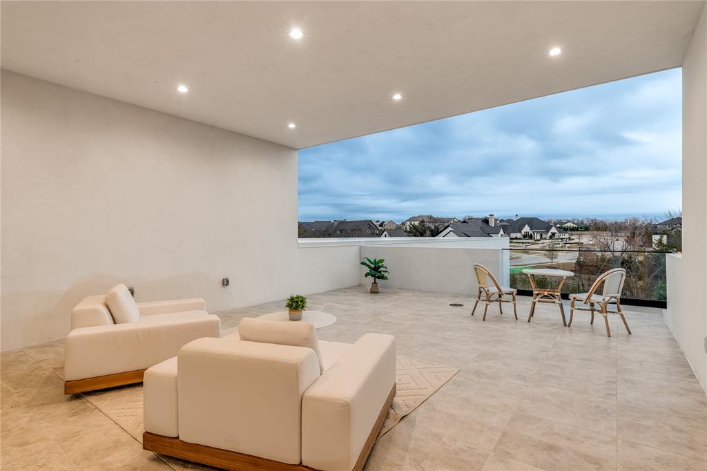 229 Sunset Pt Trail Heath, TX 75032 - Photo 35 of 40 a living room with furniture and a flat screen tv