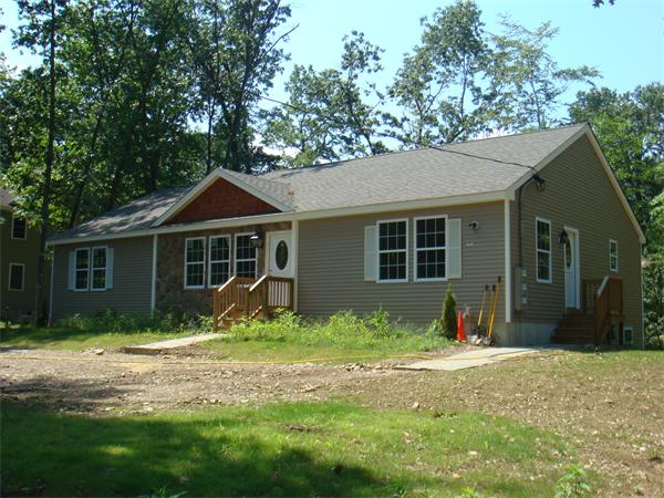 6 Longfellow Road, Unit 1 Groton, MA 01450 - Photo 1 of 1 a front view of a house with a yard