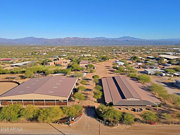 a bedroom with a bed and a television