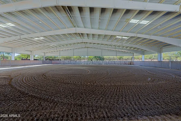 a bathroom with a glass shower door and a mirror