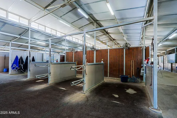 a view of a swimming pool with a table and chairs