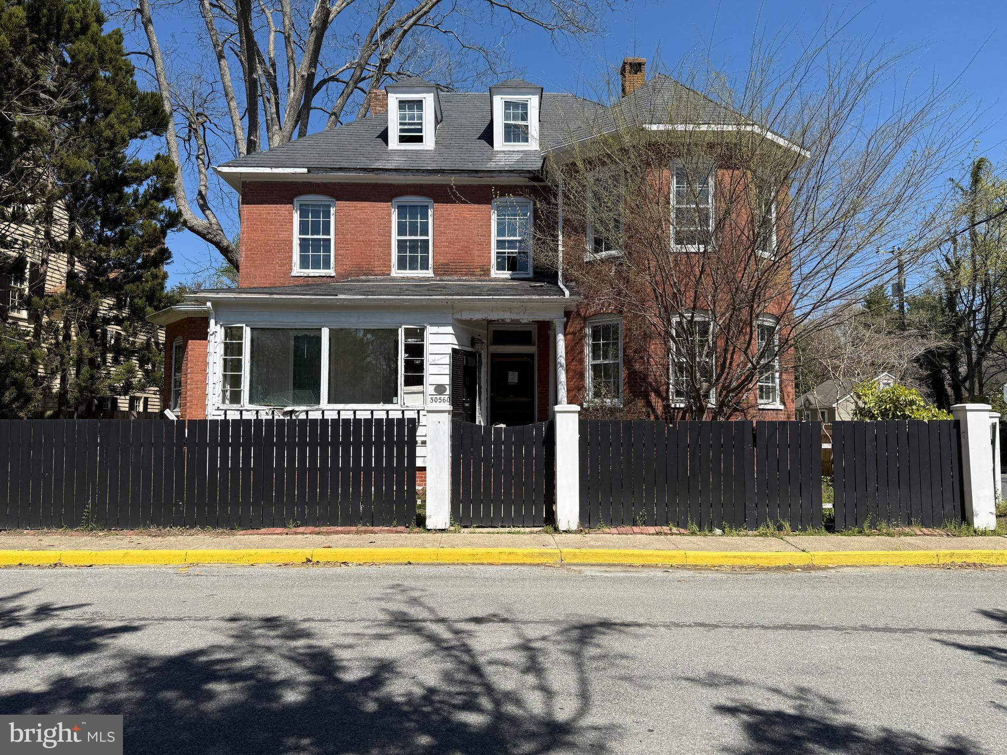 30560 Washington Street Princess Anne, MD 21853 - Photo 1 of 29 a view of a large building with a swimming pool
