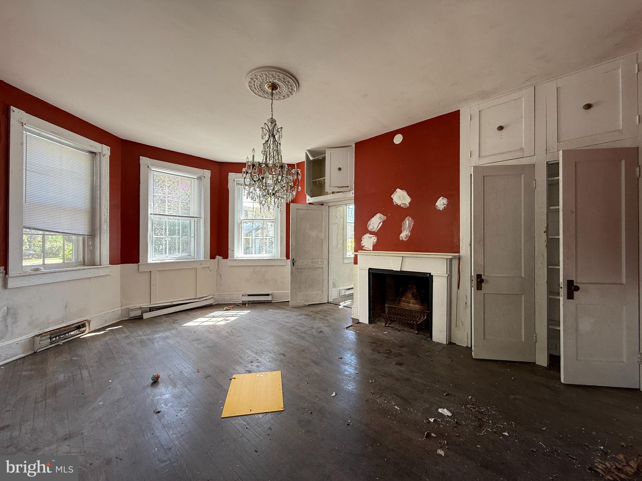 30560 Washington Street Princess Anne, MD 21853 - Photo 12 of 29 a view of an empty room with a fireplace and window