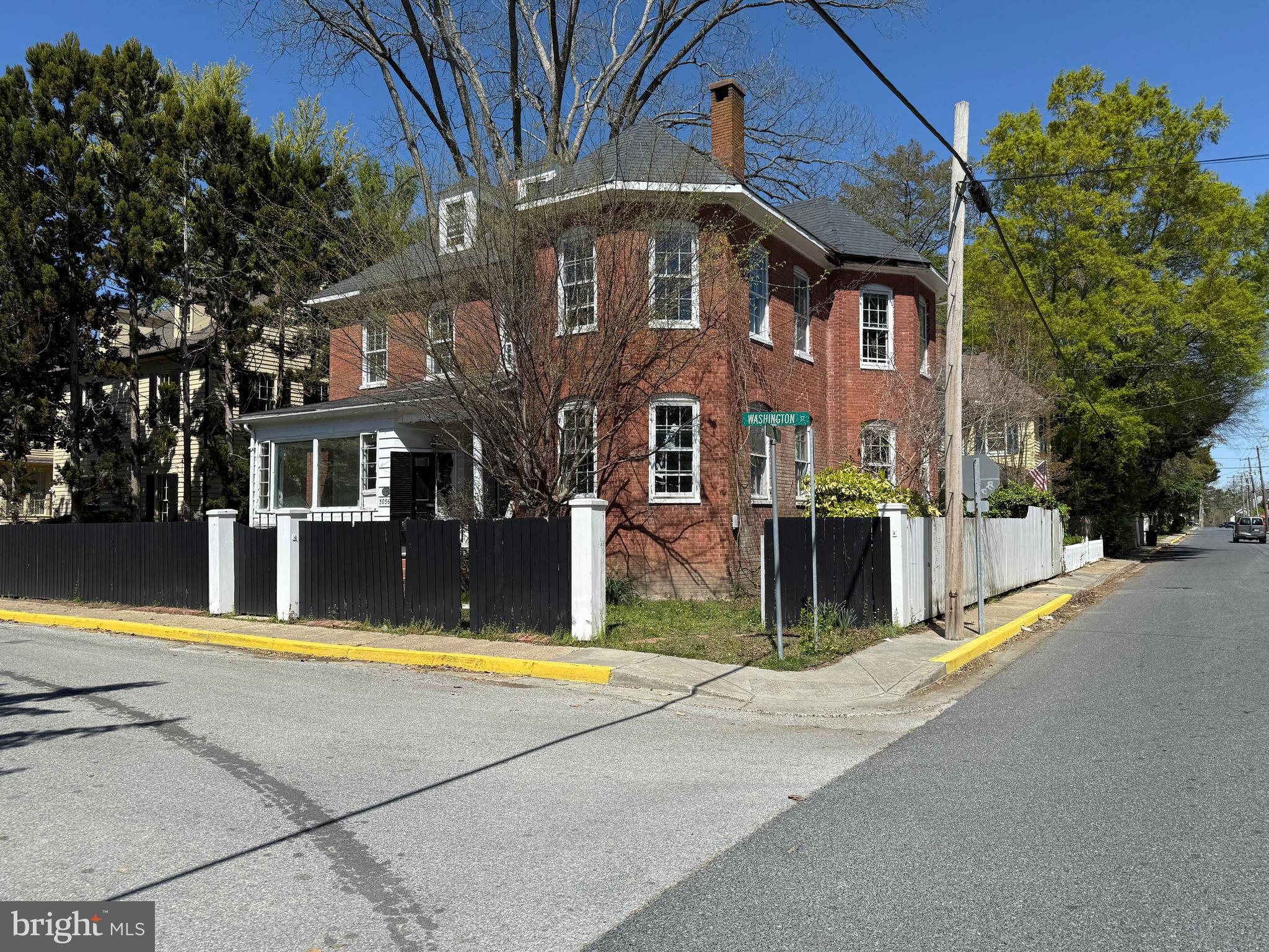 30560 Washington Street Princess Anne, MD 21853 - Photo 2 of 29 a view of a building with a swimming pool