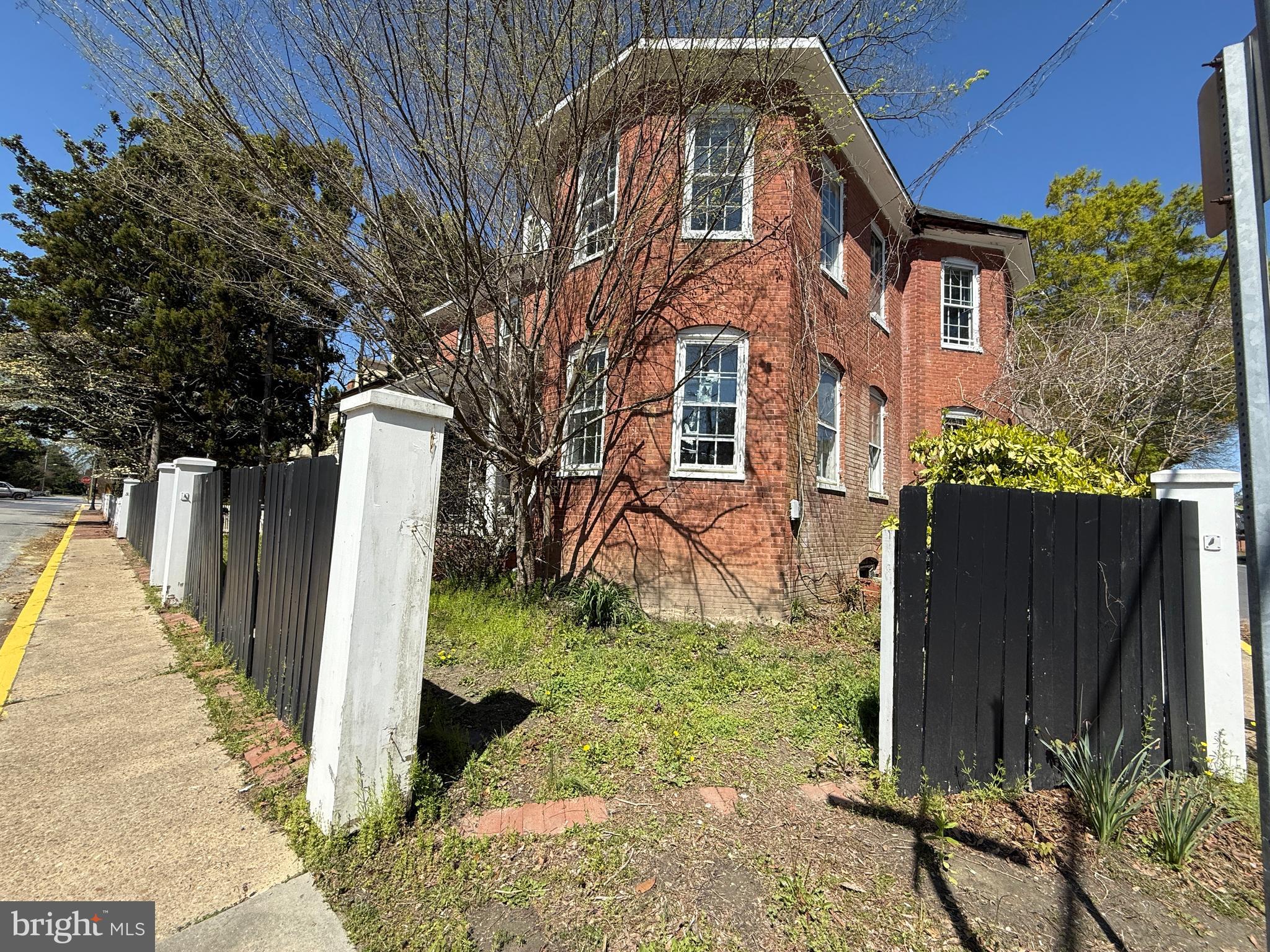 30560 Washington Street Princess Anne, MD 21853 - Photo 23 of 29 a view of a brick house with a yard
