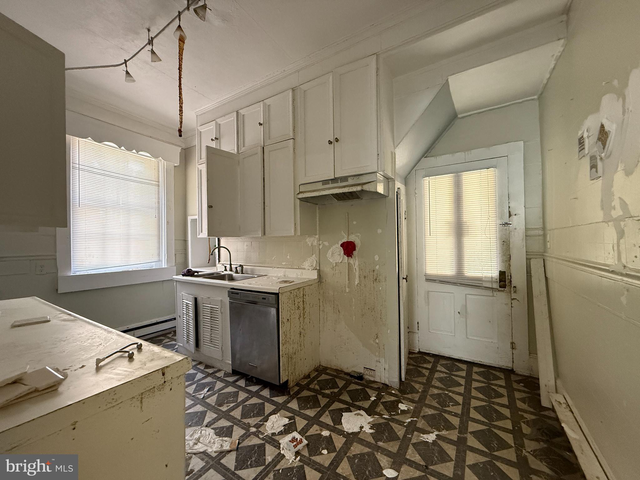 30560 Washington Street Princess Anne, MD 21853 - Photo 7 of 29 a kitchen with a sink stove and refrigerator
