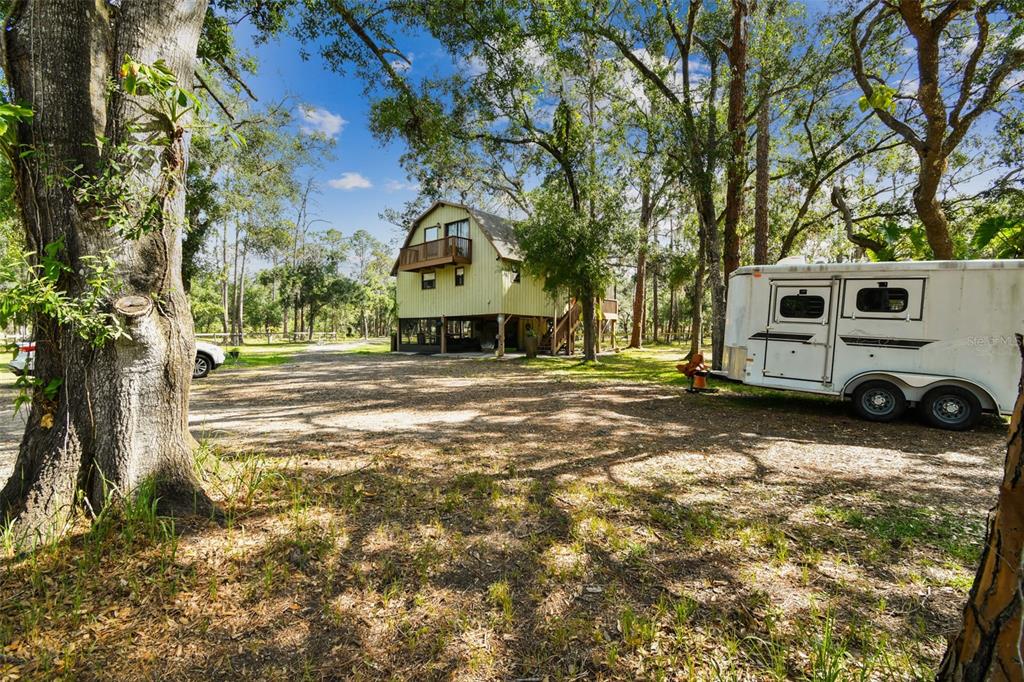 2853 Saffold Road Wimauma, FL 33598 - Photo 13 of 62 a view of a house with a yard