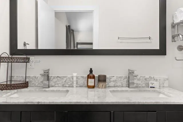 a bathroom with sink and mirror
