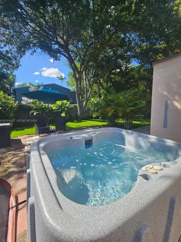 a view of a swimming pool with a sitting space