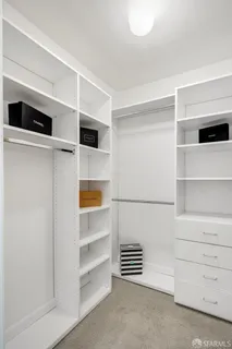 a bedroom with a bed and a table in it