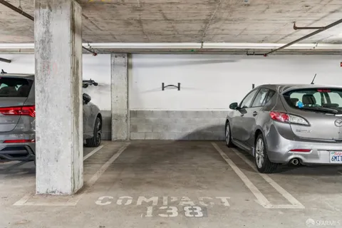 a view of living room with furniture and wooden floor