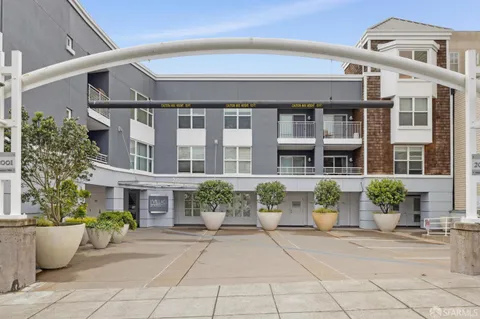 a building with potted plants in front of it