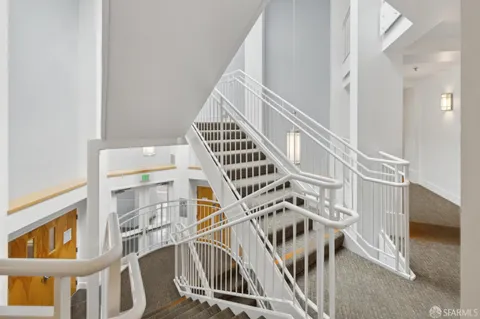 a view of a patio with table and chairs and potted plants
