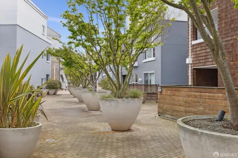 a view of a chair and table in the backyard
