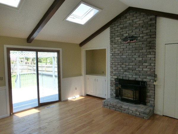 8 Metacomet Road Longmeadow, MA 01106 - Photo 5 of 16 a view of empty room with wooden floor and fireplace
