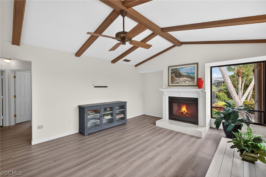 1312 Par View Drive Sanibel, FL 33957 - Photo 11 of 45 a living room with furniture and a fireplace
