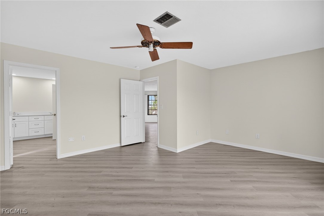 1312 Par View Drive Sanibel, FL 33957 - Photo 18 of 45 wooden floor in an empty room