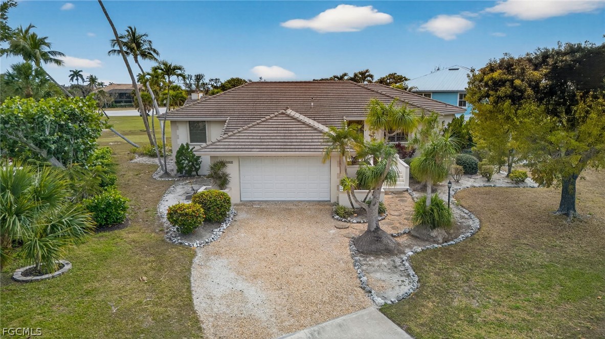1312 Par View Drive Sanibel, FL 33957 - Photo 31 of 45 a view of a house with a yard and potted plants