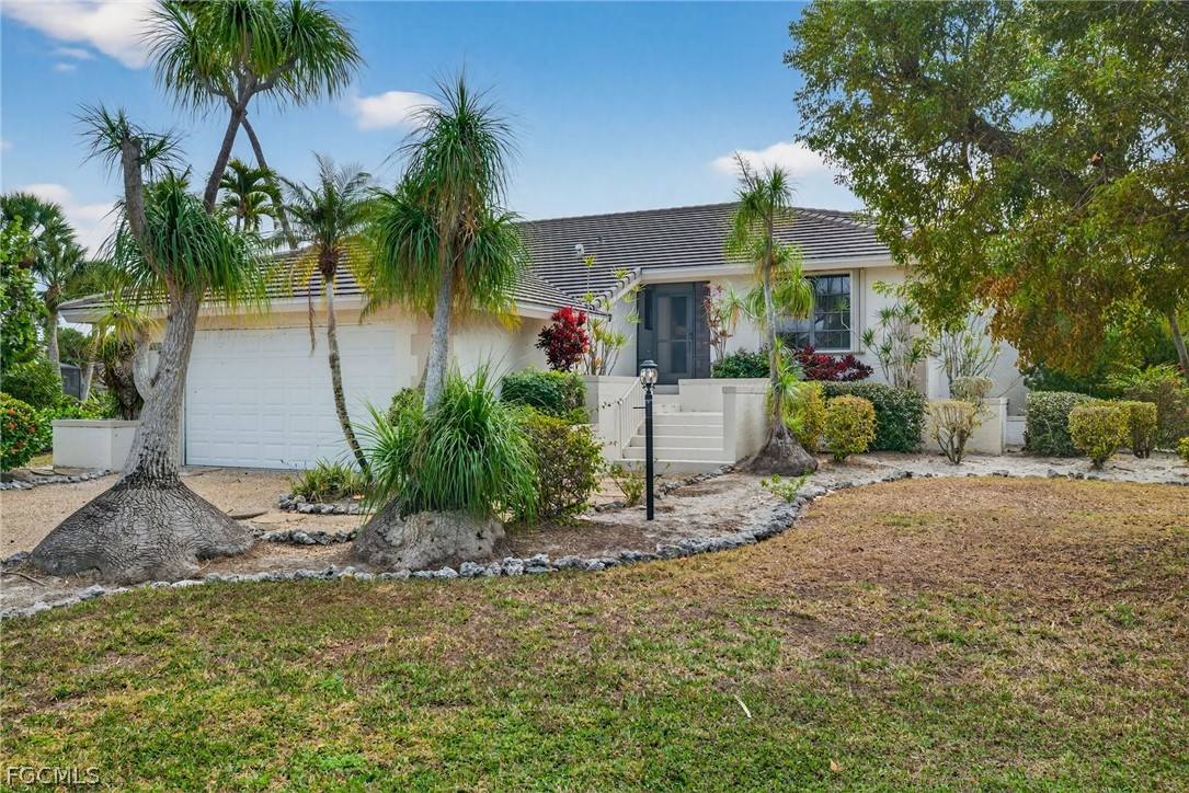 1312 Par View Drive Sanibel, FL 33957 - Photo 43 of 45 a front view of a house with garden