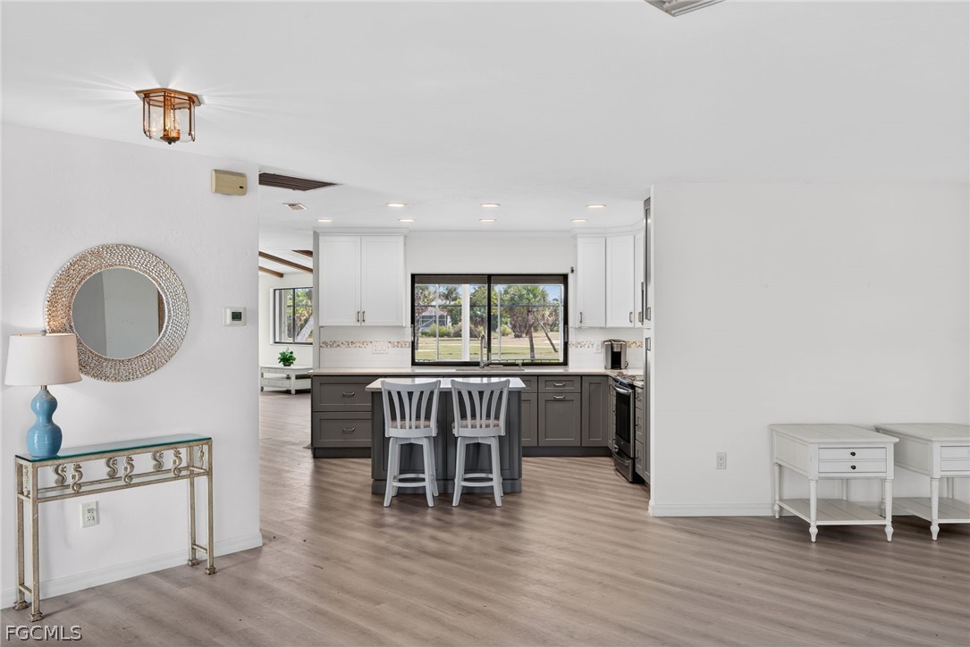 1312 Par View Drive Sanibel, FL 33957 - Photo 6 of 45 a dining room with furniture window and wooden floor