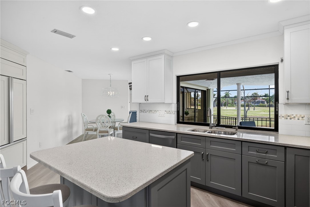 1312 Par View Drive Sanibel, FL 33957 - Photo 7 of 45 a kitchen with a stove a sink and a refrigerator