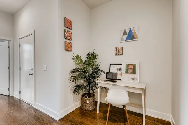 a workspace with furniture and wooden floor